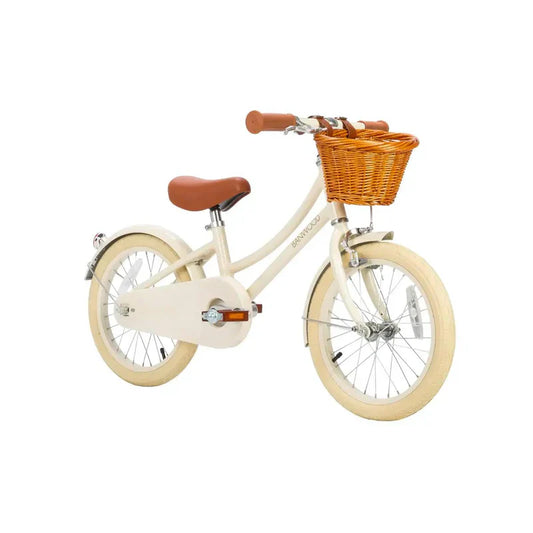 Children's bicycle with a basket on a white background