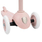 Pink balance scooter with white wheels on a white background