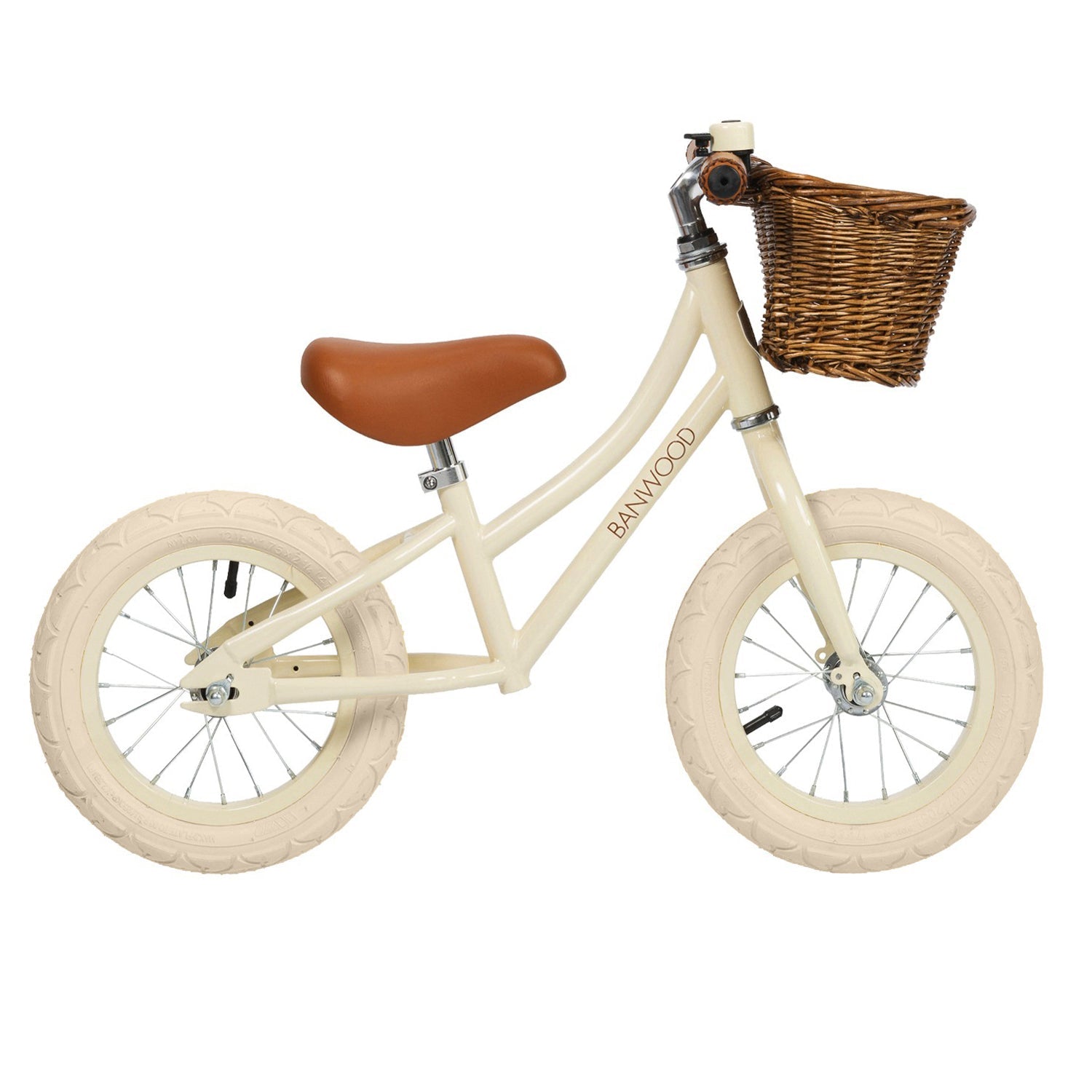 Beige balance bike with a brown seat and basket on a white background