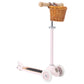 Pink scooter with a wicker basket on a white background