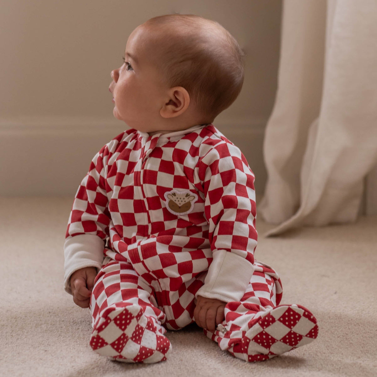 Avery Row Christmas Baby Jersey Sleepsuit - Red Checkerboard