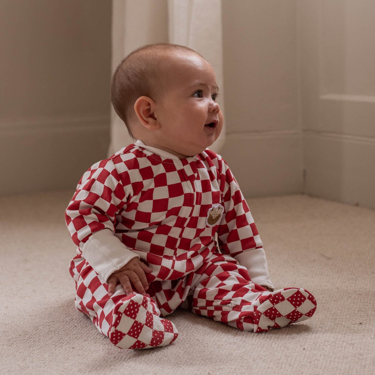 Avery Row Christmas Baby Jersey Sleepsuit - Red Checkerboard