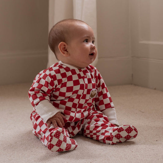Avery Row Christmas Baby Jersey Sleepsuit - Red Checkerboard