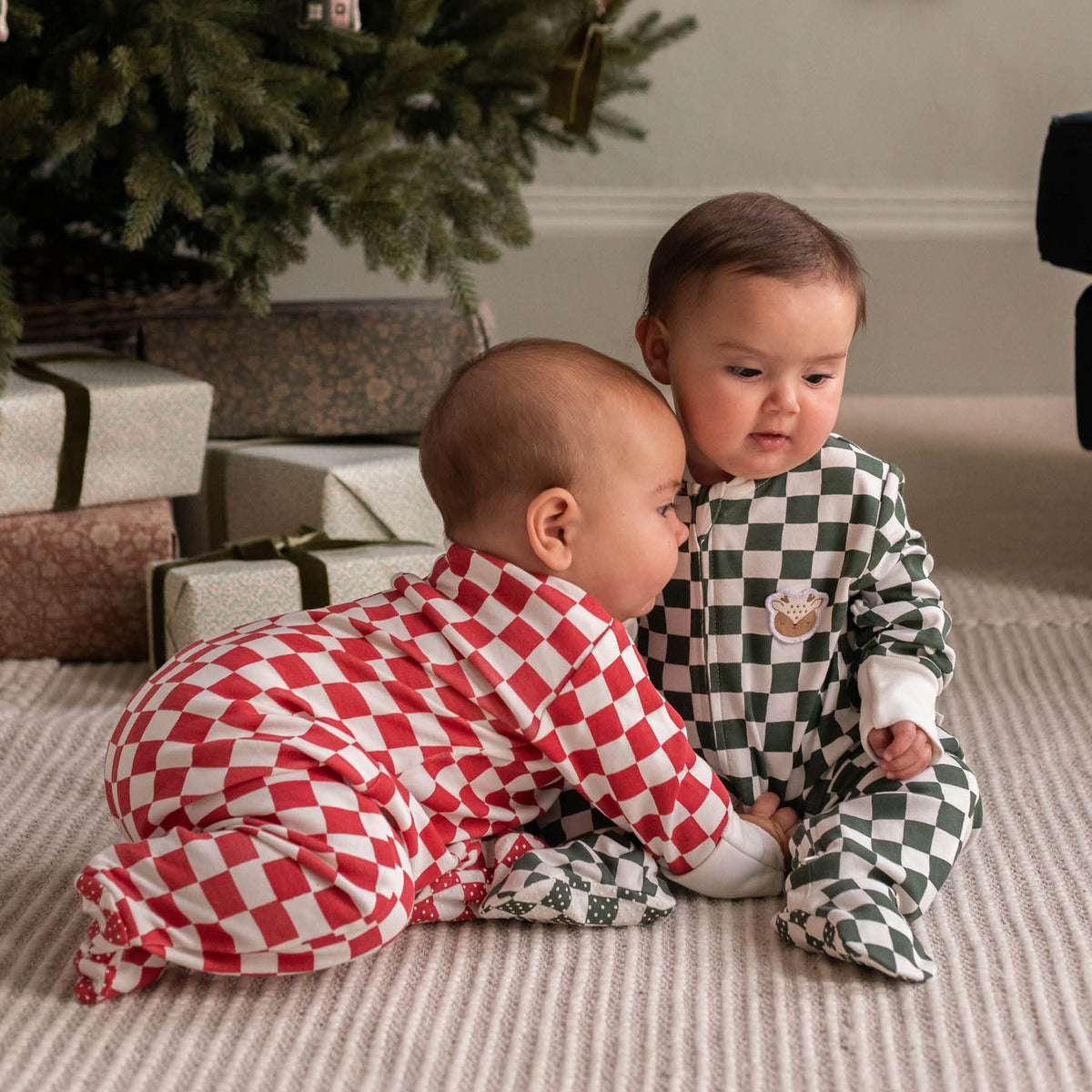 Avery Row Christmas Baby Jersey Sleepsuit - Red Checkerboard