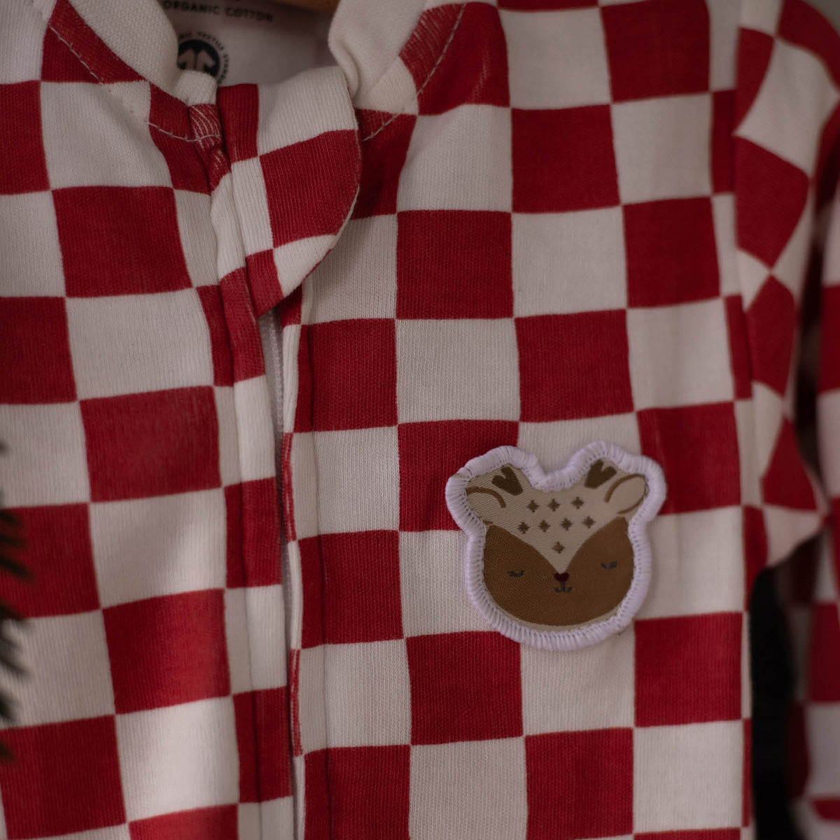 Avery Row Christmas Baby Jersey Sleepsuit - Red Checkerboard