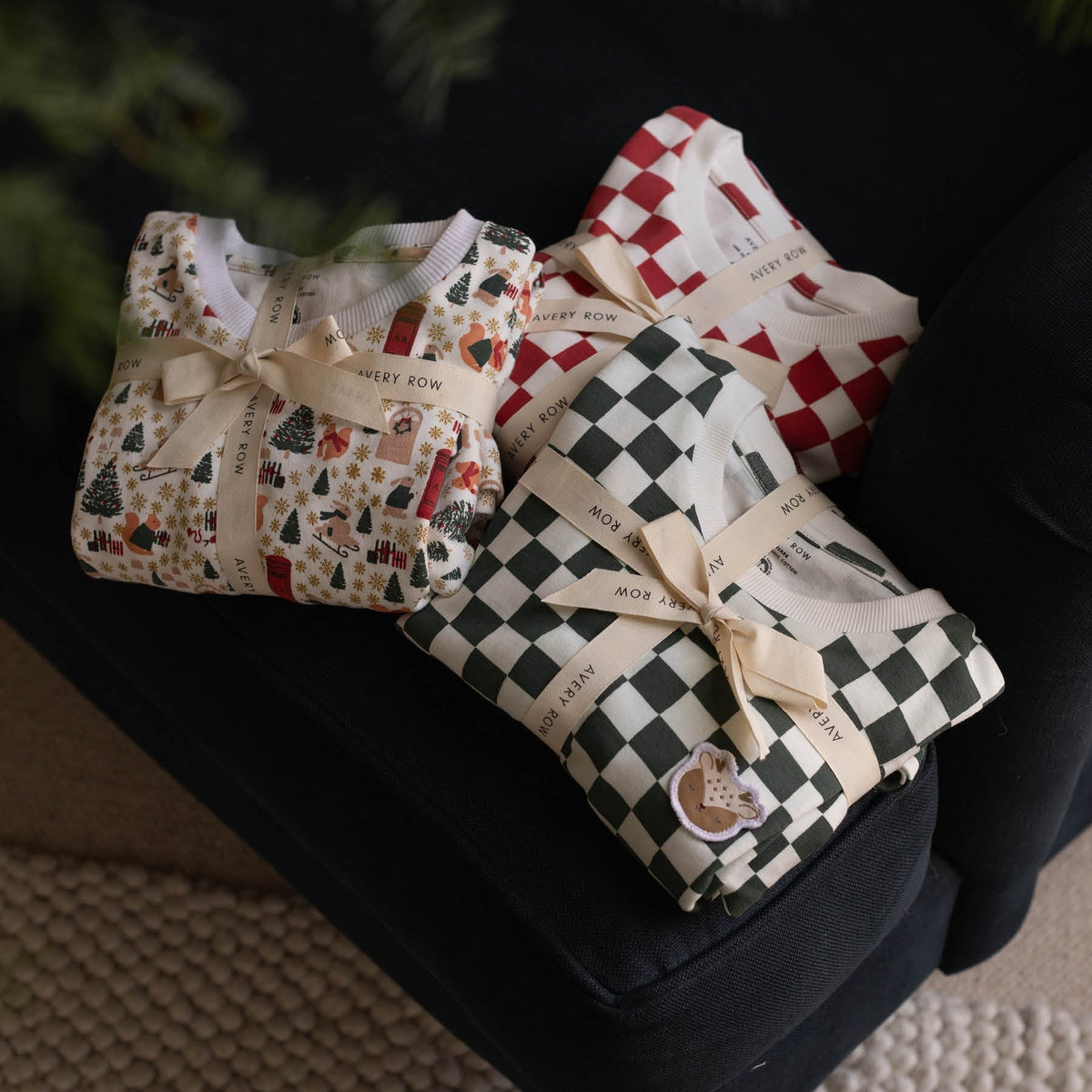 Avery Row Christmas Baby Jersey Sleepsuit - Red Checkerboard
