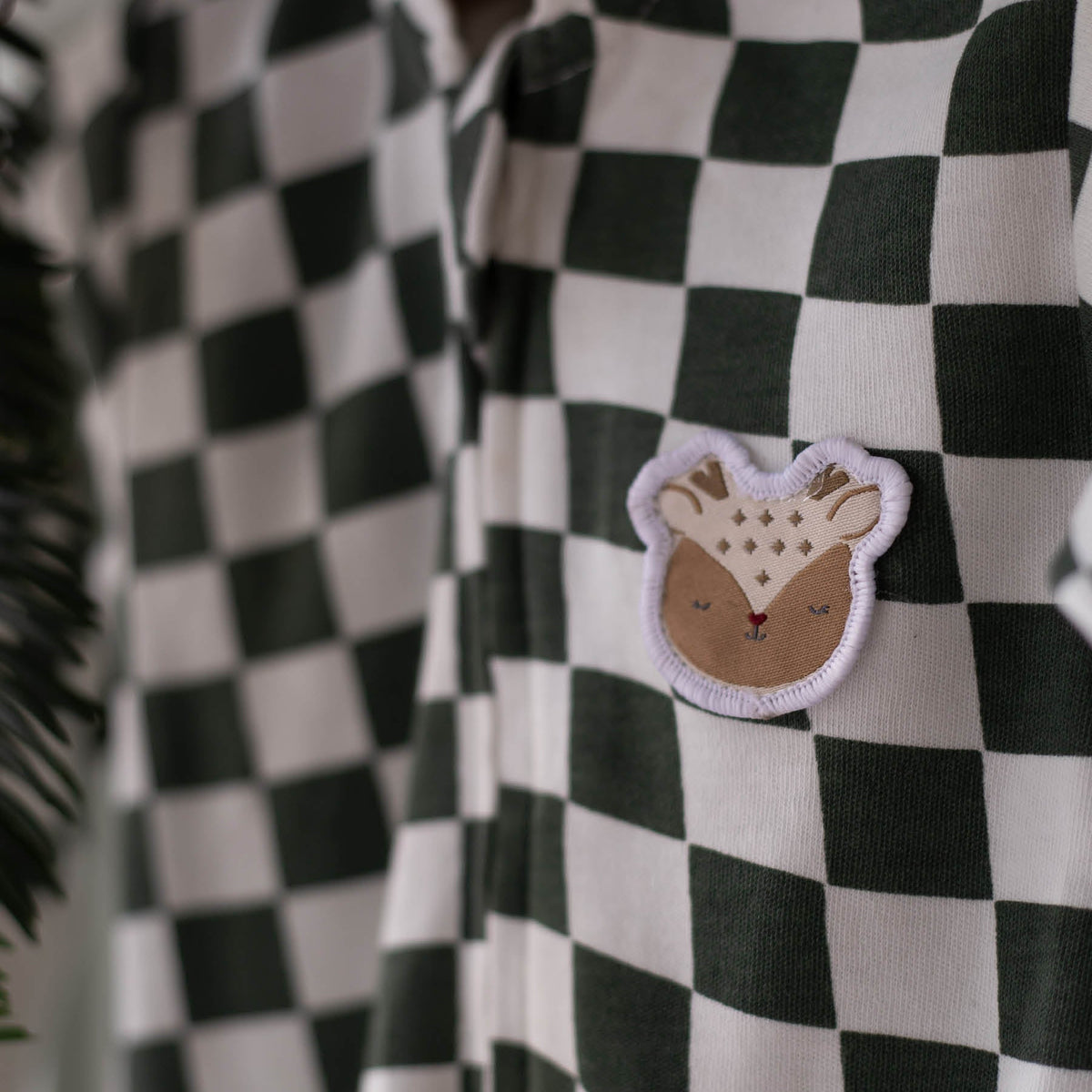 Avery Row Christmas Baby Jersey Sleepsuit - Green Checkerboard