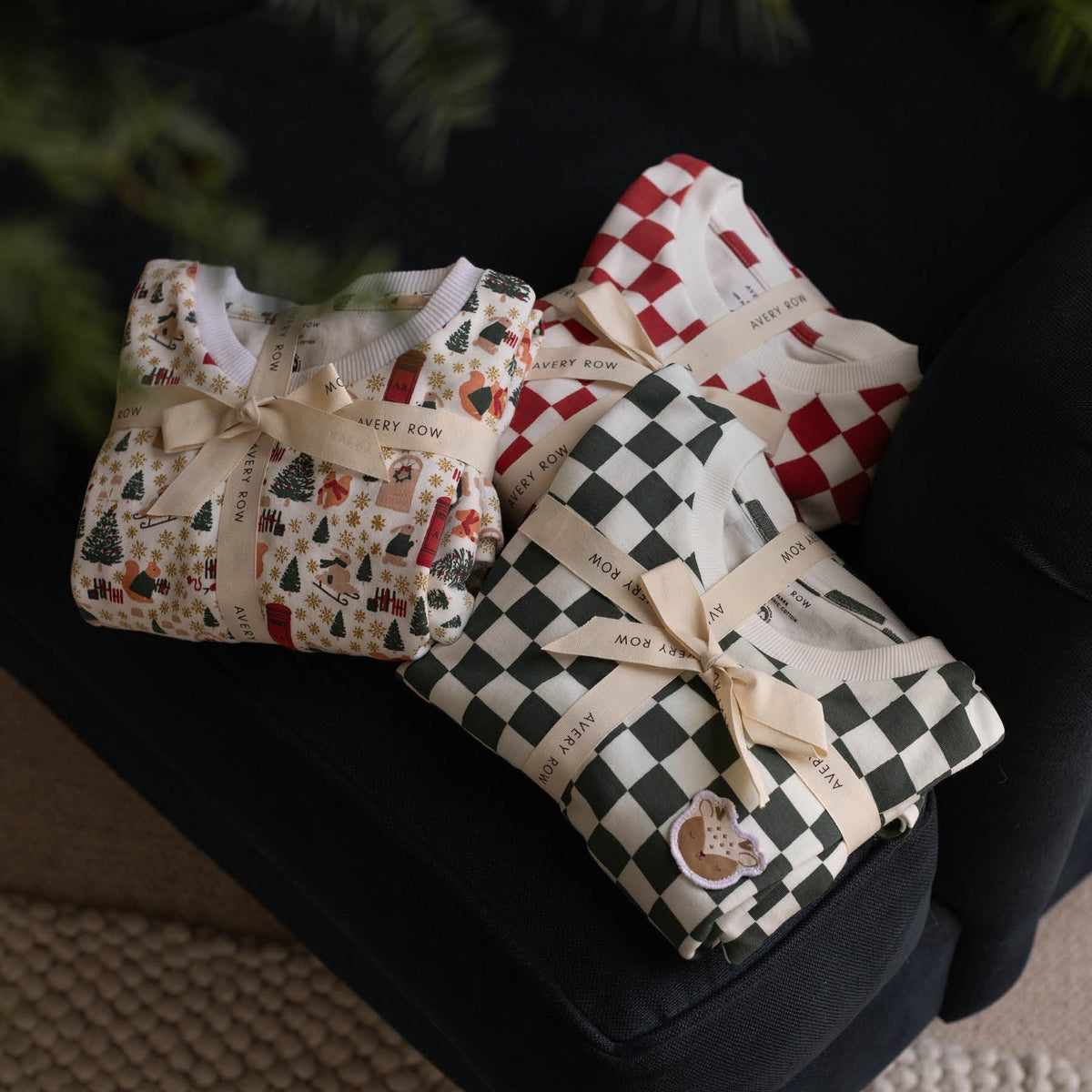 Avery Row Christmas Baby Jersey Sleepsuit - Green Checkerboard