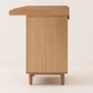 Wooden cabinet with a small shelf on a white background