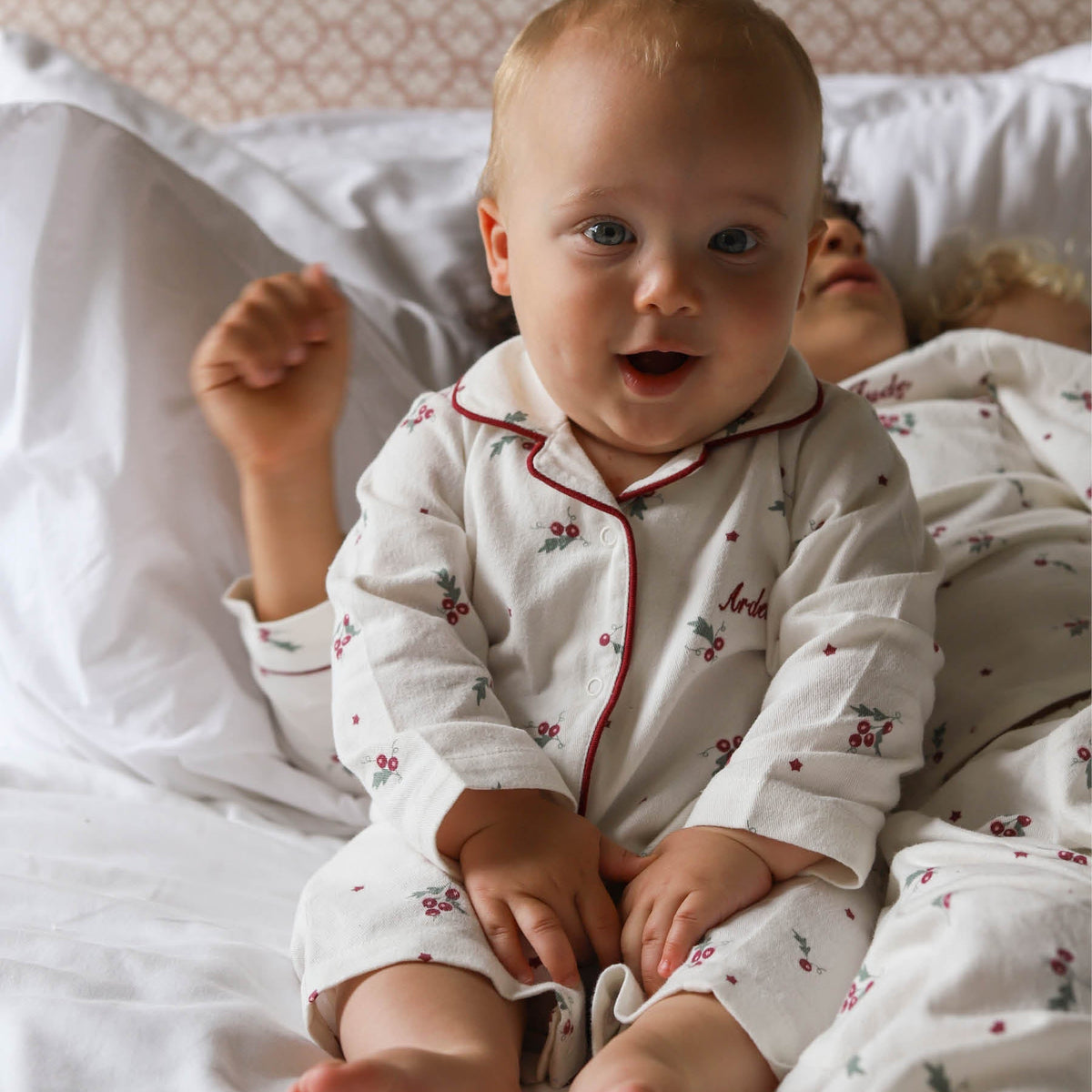 Avery Row Baby Flannel Sleepsuit - Holly Scatter