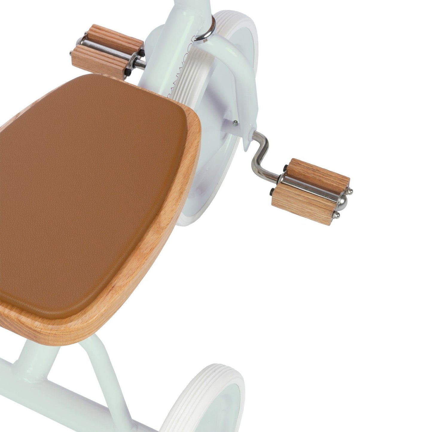 Close-up of a trike with a brown seat and wooden pedals on a white background