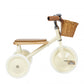 Children's tricycle with a wooden seat and basket on a white background