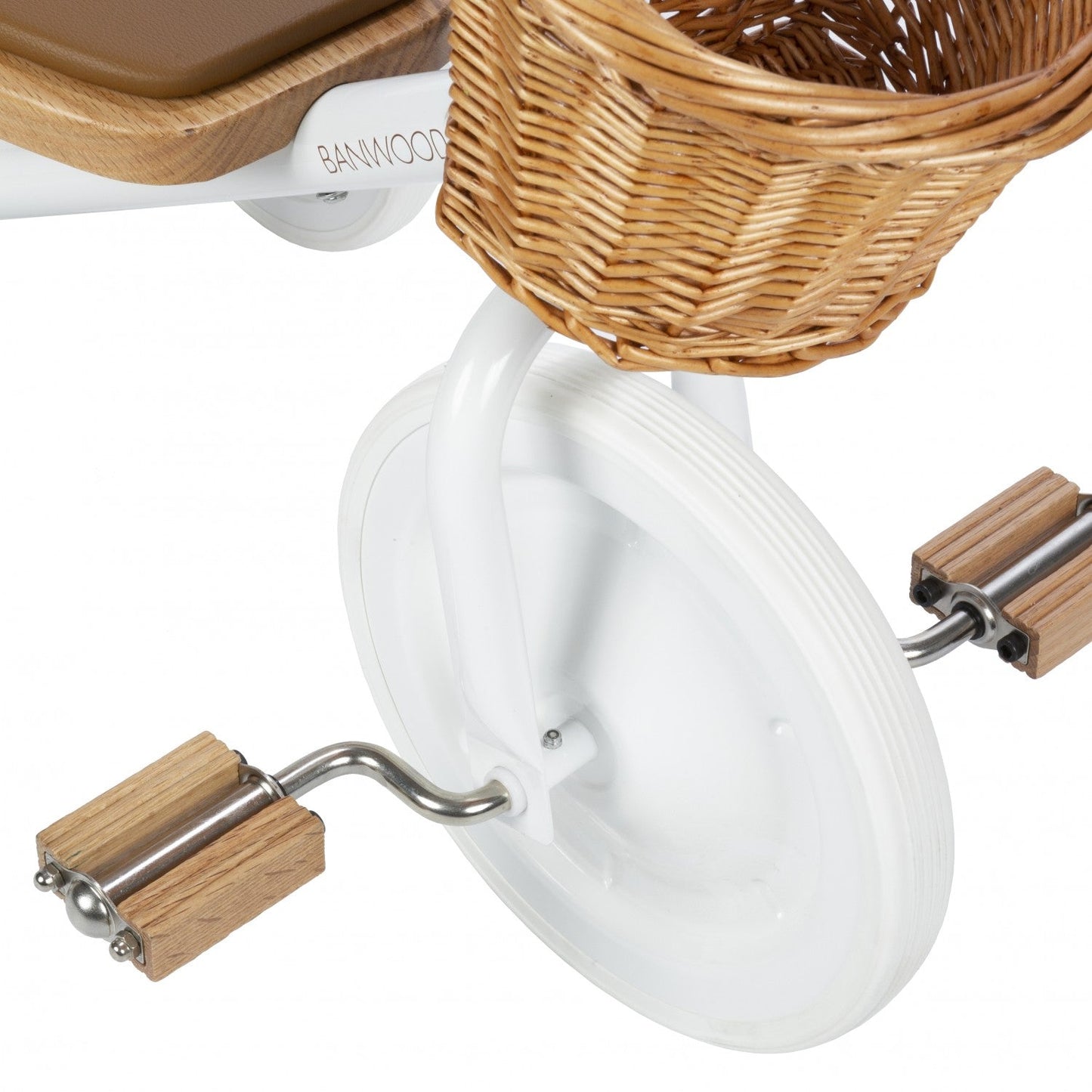White trike with wooden handles and a wicker basket on a white background