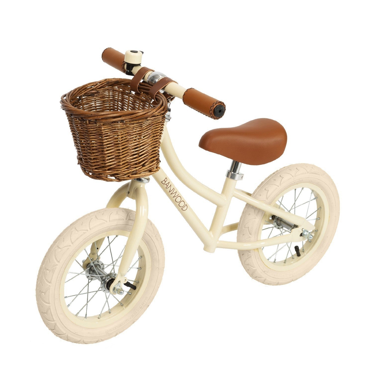 Children's balance bike with a wicker basket on a white background