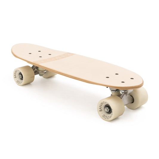 Wooden skateboard with beige wheels on a white background